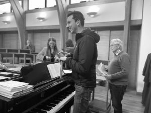 Adam Wilson conducts a WCCC rehearsal